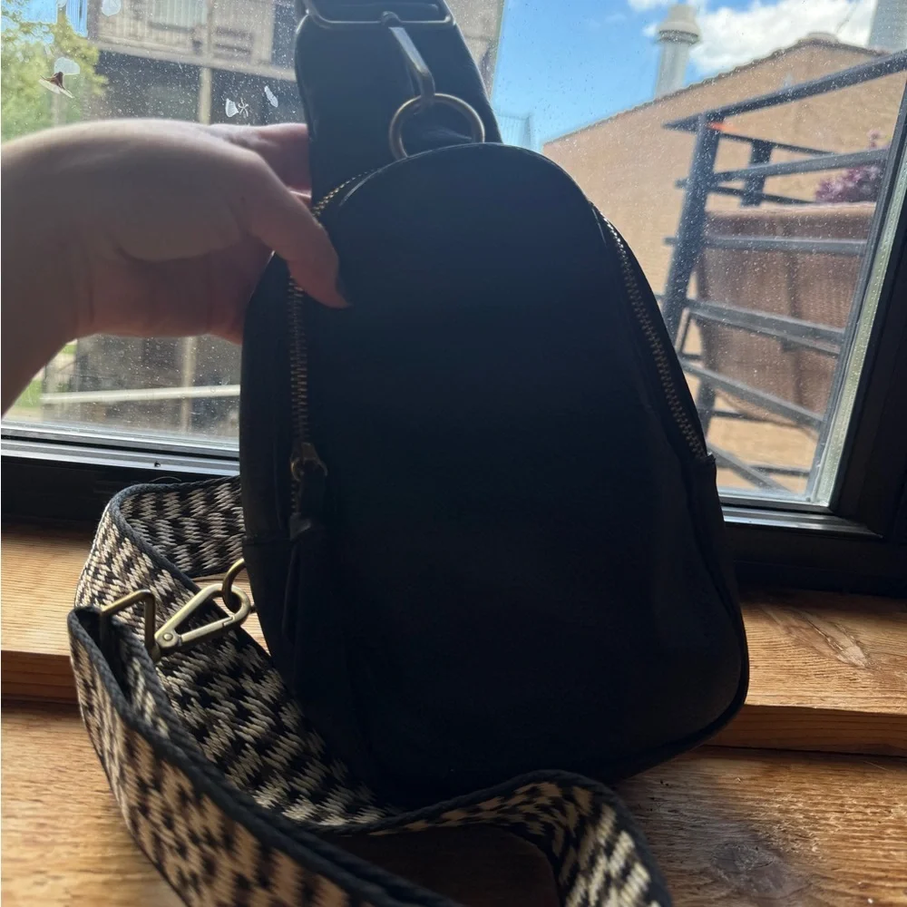 Anthropologie — Black faux Leather sling Bag with fabric Checkered Strap